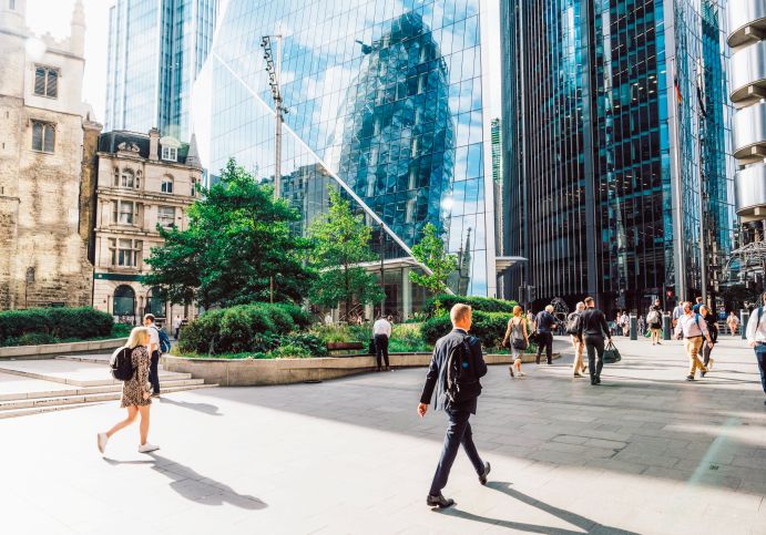 Workers in the City of London walking towards their office following redundancy and restructuring